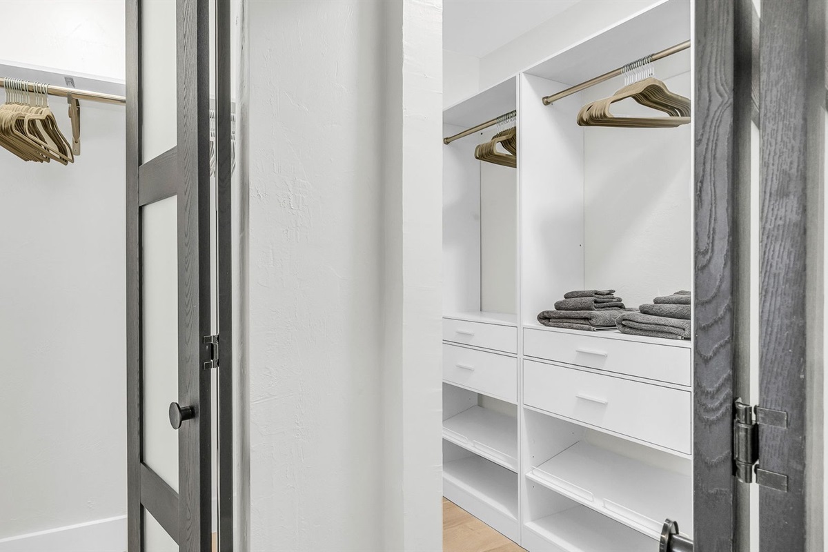 The suite’s double closet features sleek built-ins and abundant storage, combining style with function.