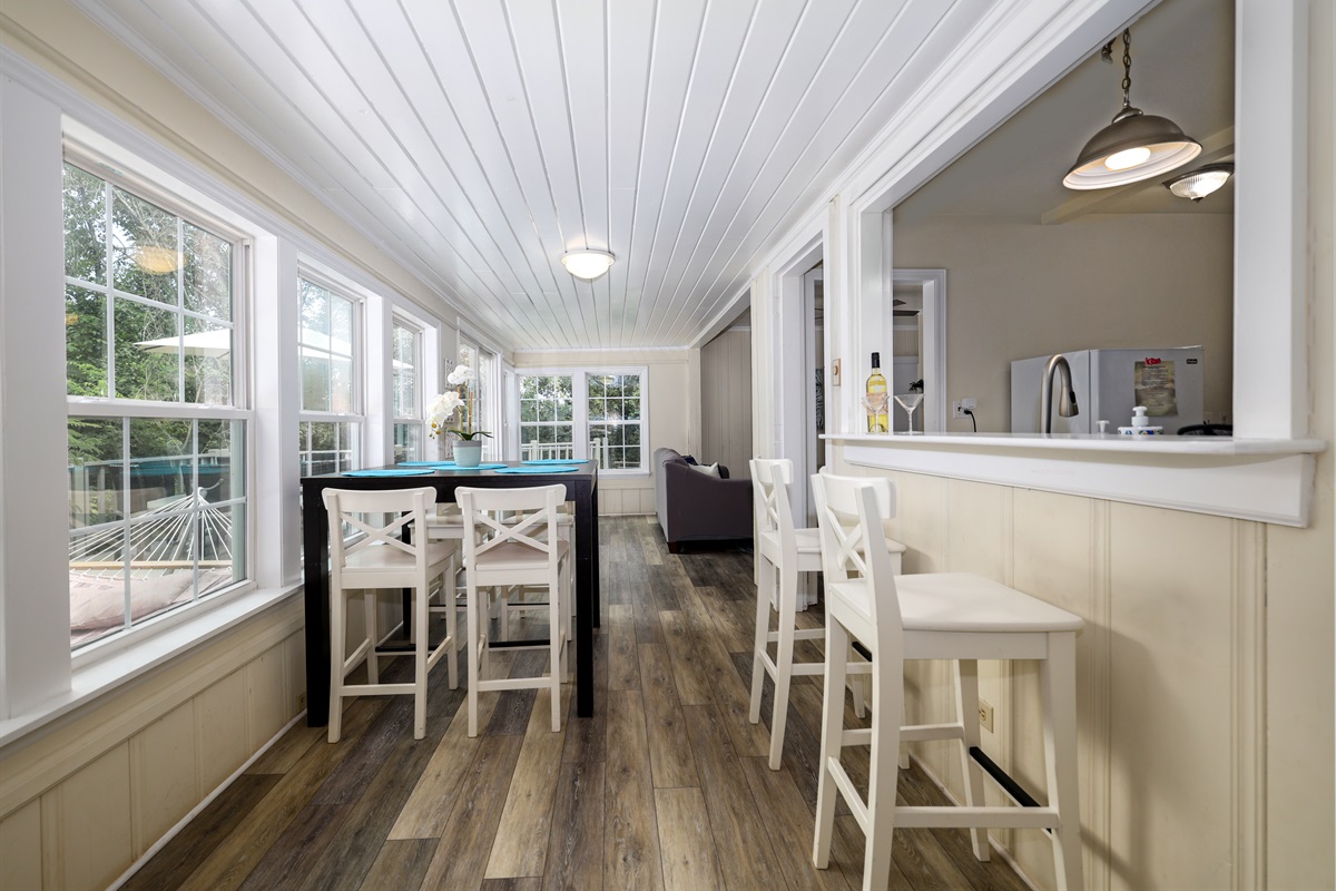 Dining area with hightop seating and pass through bar top seating