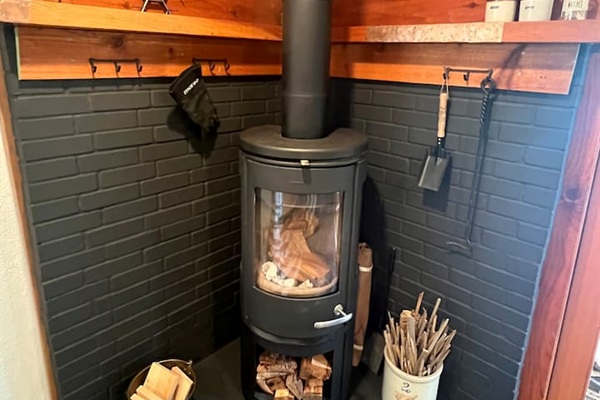 European wood burning fireplace to create the perfect cabin ambiance and warmth. Kindling and wood on site