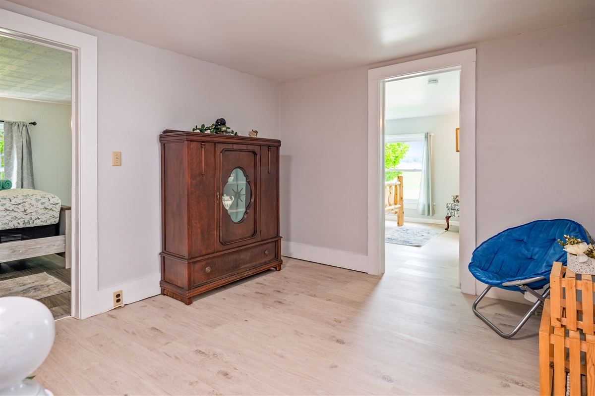 Versatile upstairs landing space ideal for reading, relaxing, or accessing nearby guest rooms.