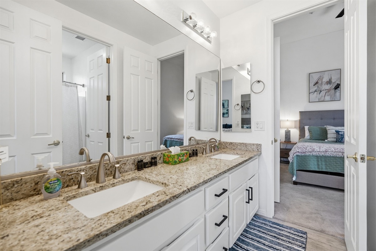 Opposite view of the Jack N Jill bathroom.  Jack N Jill bathroom with dual vanity.