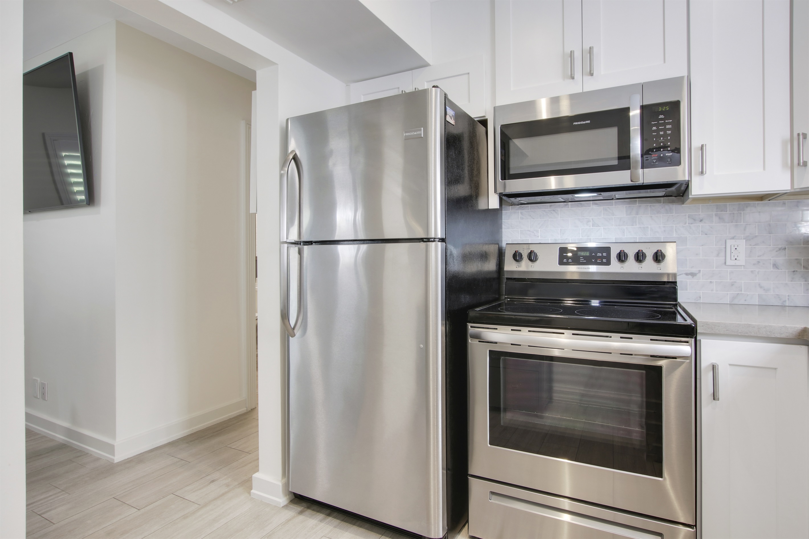 Full size fridge, oven, microwave and dishwasher