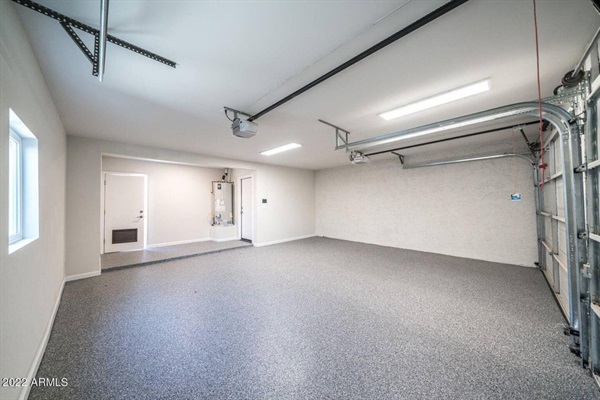Nice, epoxy floored garage with room for two more vehicles. 