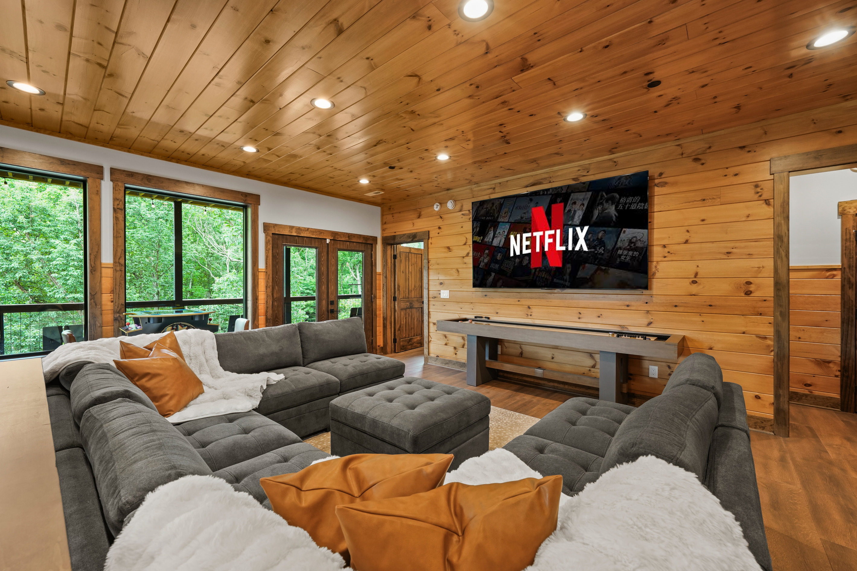 The perfect hangout after a day exploring the Smokies. Watch movies or the big game on the massive 100-inch TV, relax on the plush sectional, or grab a drink at the bar-top seating. Enjoy hours of fun with pool, shuffleboard, foosball, and classic arcade t