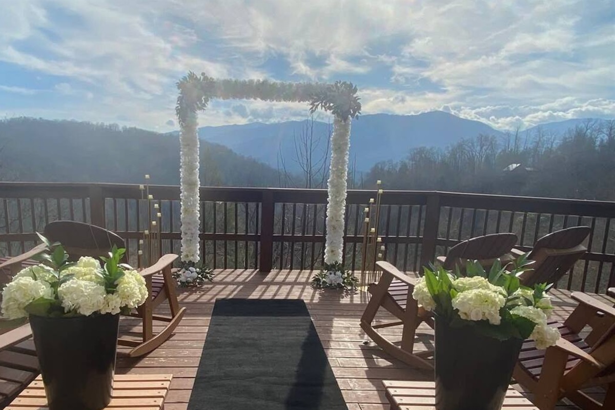 Picture your ceremony right here, with the bride and groom framed by breathtaking mountain views—an unforgettable start to forever. (Arch not included)