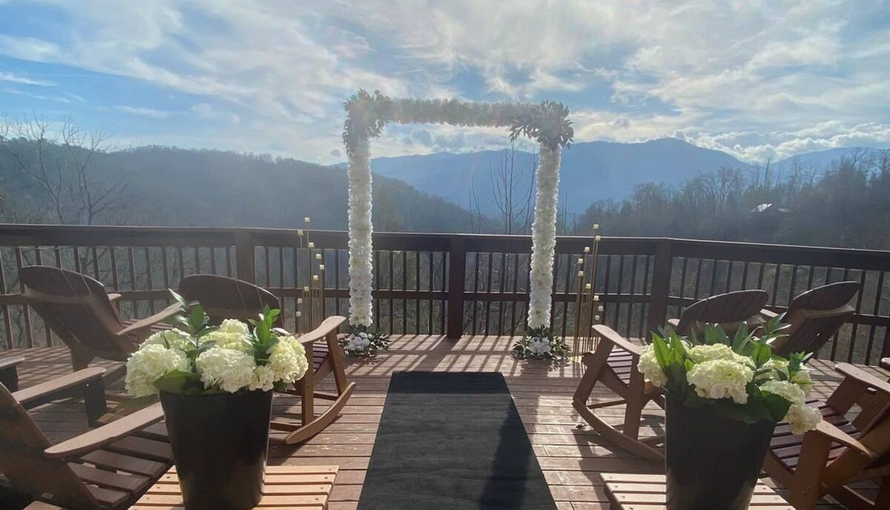 Picture your ceremony right here, with the bride and groom framed by breathtaking mountain views—an unforgettable start to forever. (Arch not included)