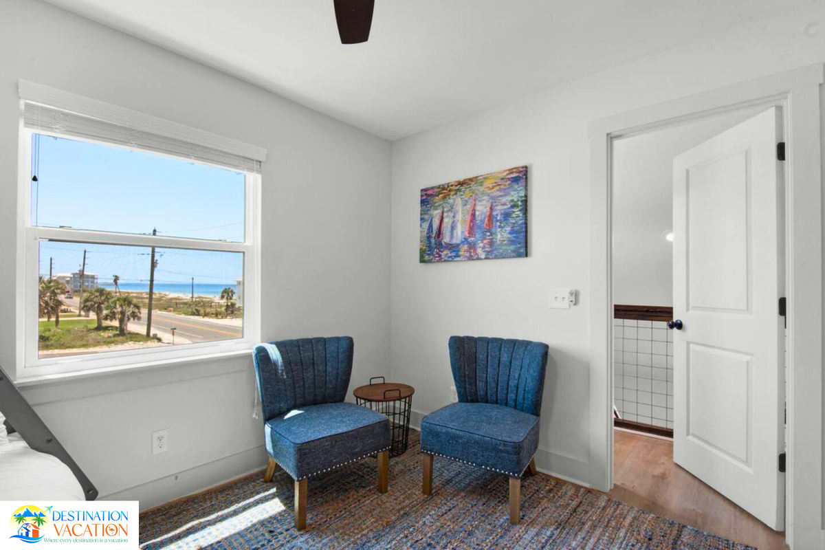 Relax in the sitting area with beautiful coastal views.