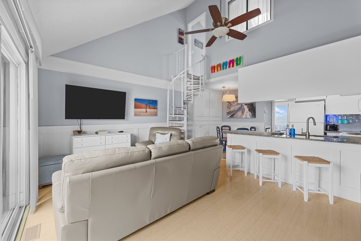 An open layout flows seamlessly from the living area to the kitchen and dining space&mdash;ideal for gathering and entertaining