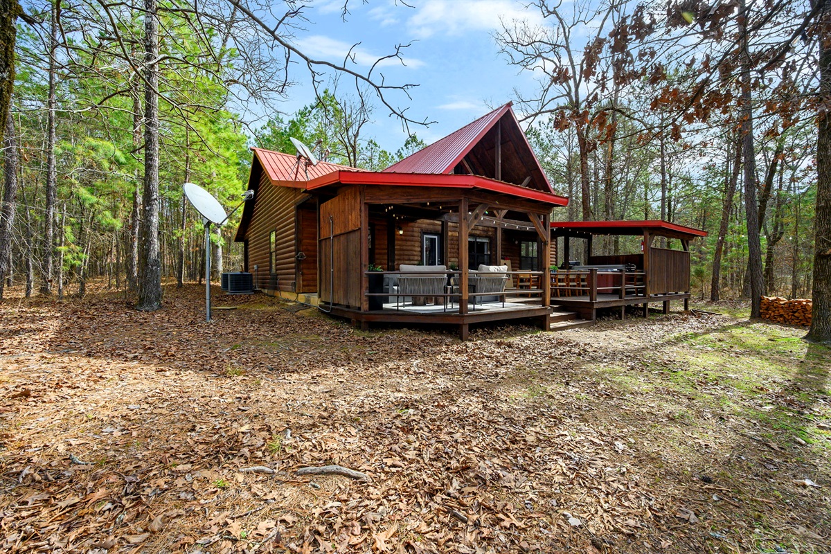 A refined woodland retreat with generous outdoor space and easy access. Designed for comfort and privacy, this cabin blends rustic architecture with upscale finishes for a polished first impression.