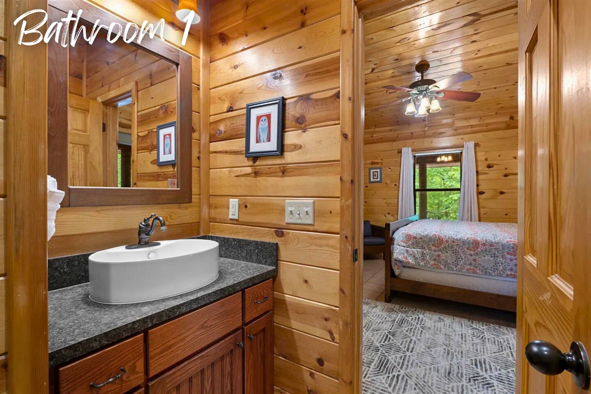 Step into this beautifully appointed bathroom, where rustic elements and modern amenities combine for a relaxing experience.