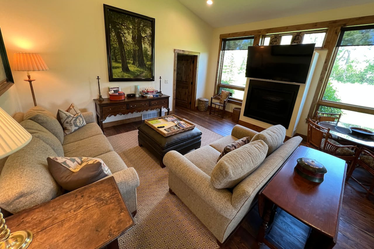 Living room with gas fireplace and Roku enabled TV 