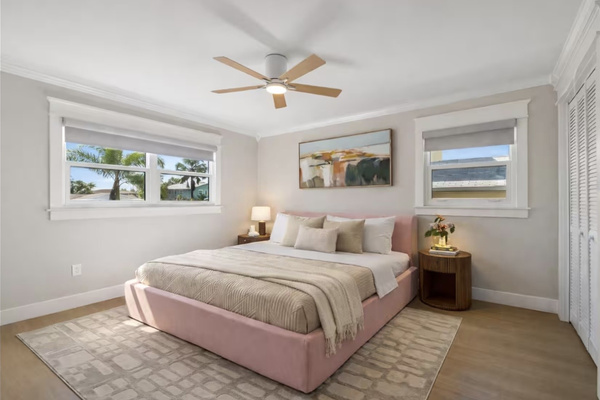 Bright, spacious bedroom with abundant natural light and closet storage.