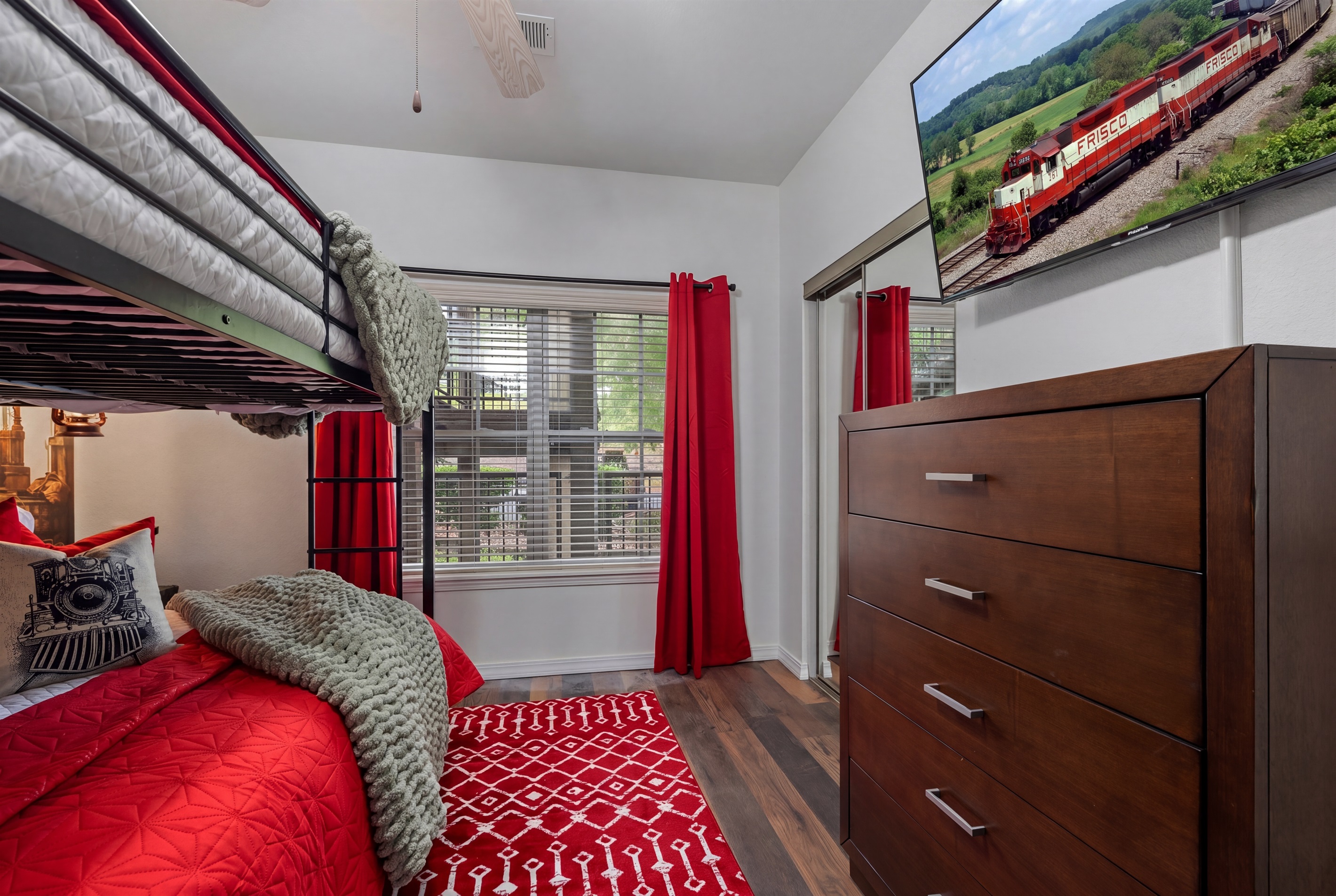 There's a large dresser, closet and large smart TV for relaxation