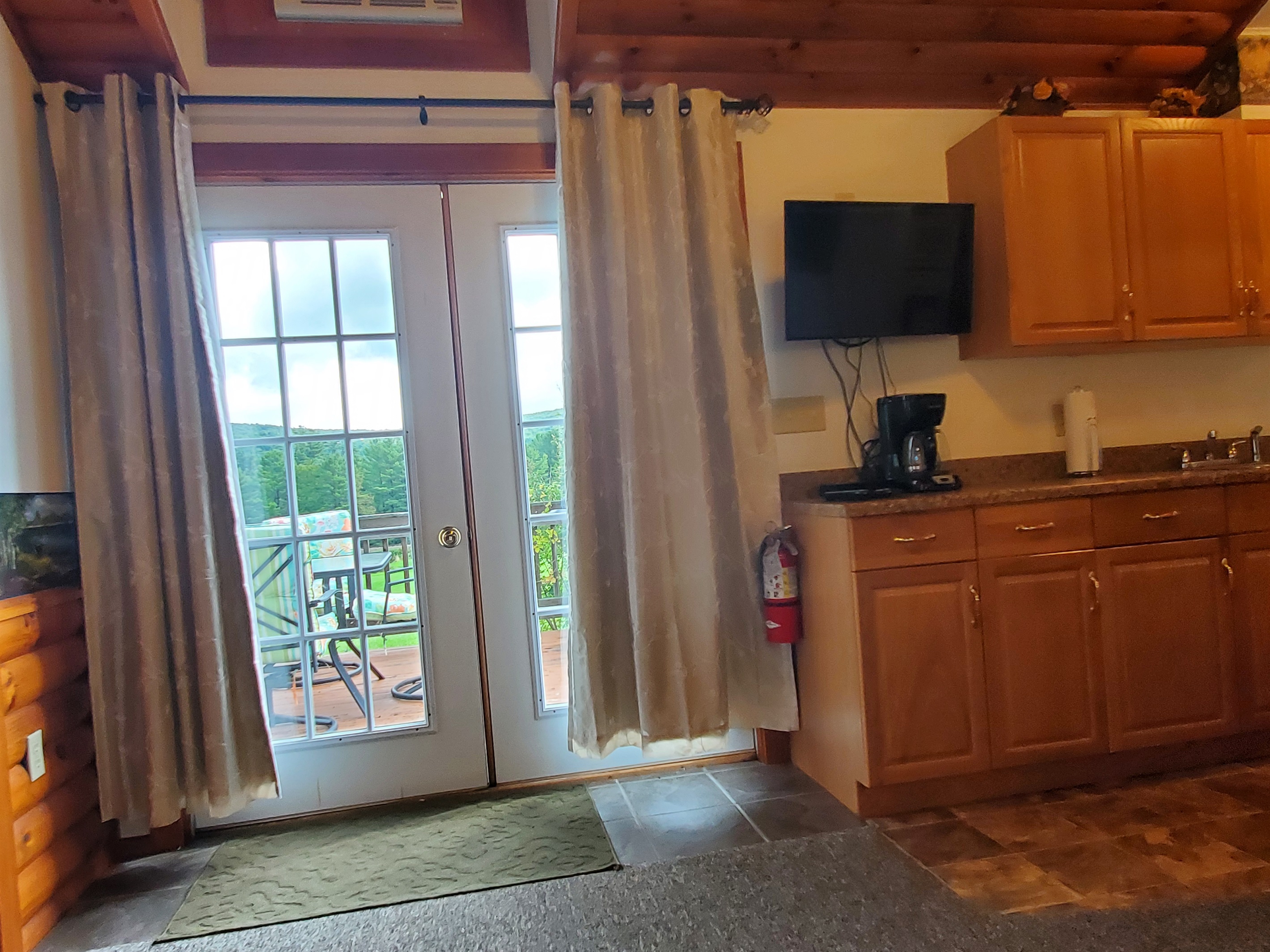 Glass doors lead out to open deck