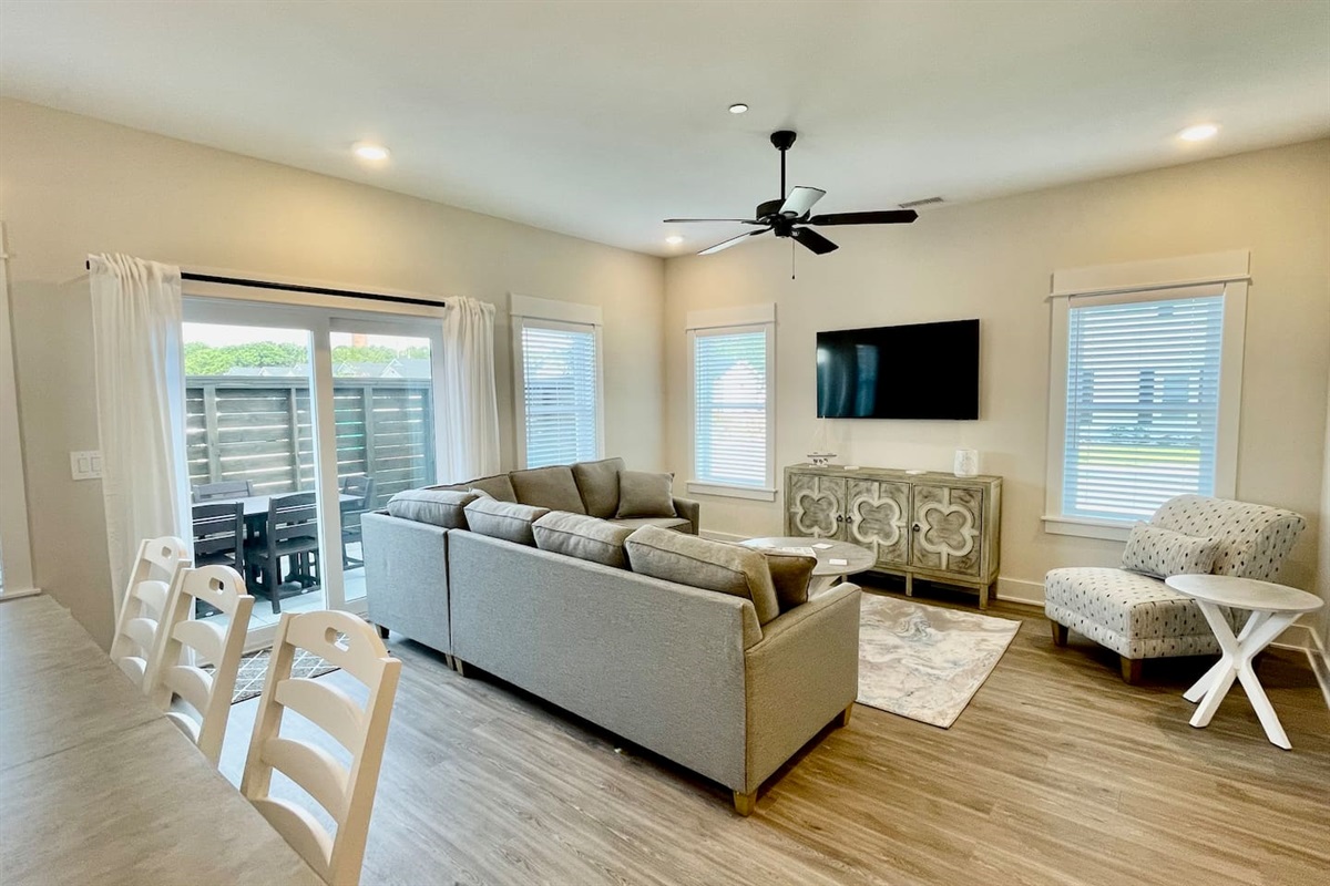 Cozy family room with plenty of seating, featuring a queen-size sofa bed for extra guests