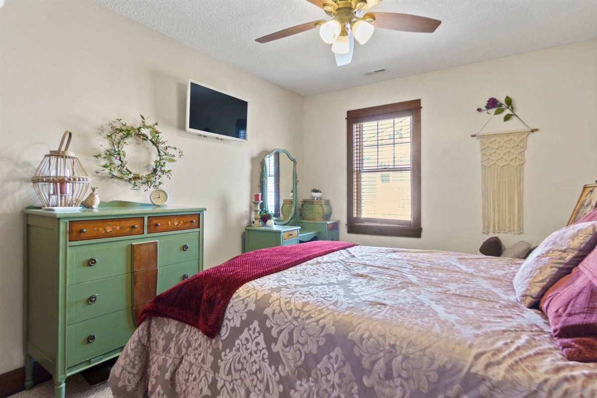 Comfortable queen-sized bedroom, offering a restful space for a peaceful night's sleep.