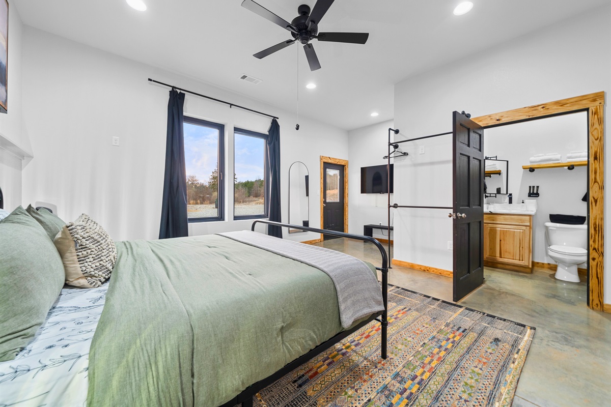 With its welcoming design and ample floor space, this bedroom makes relaxing look easy.