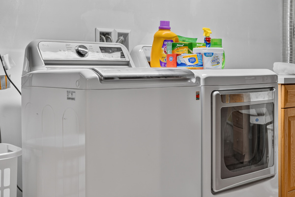 Laundry area stocked with detergent and supplies to make longer stays easy.