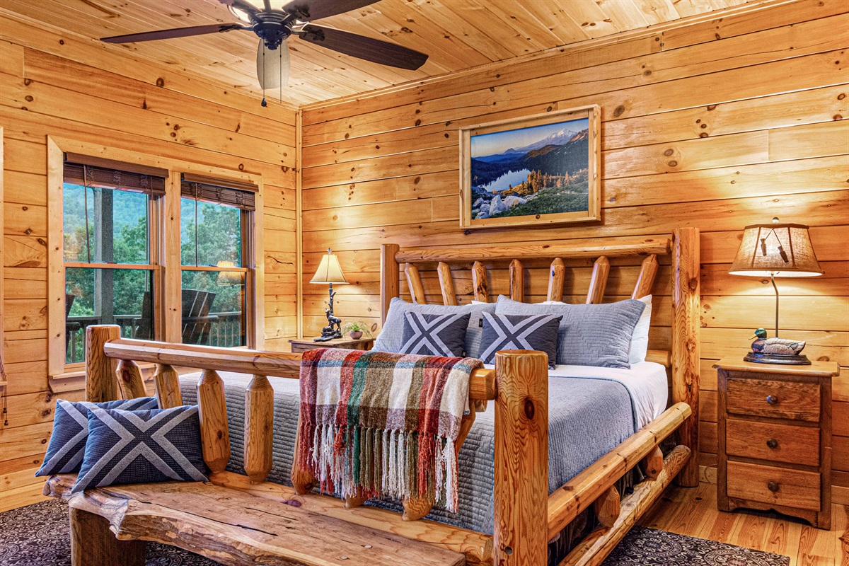 Rustic Retreat: Enjoy mountain views from this charming wooden sanctuary with plush bedding.