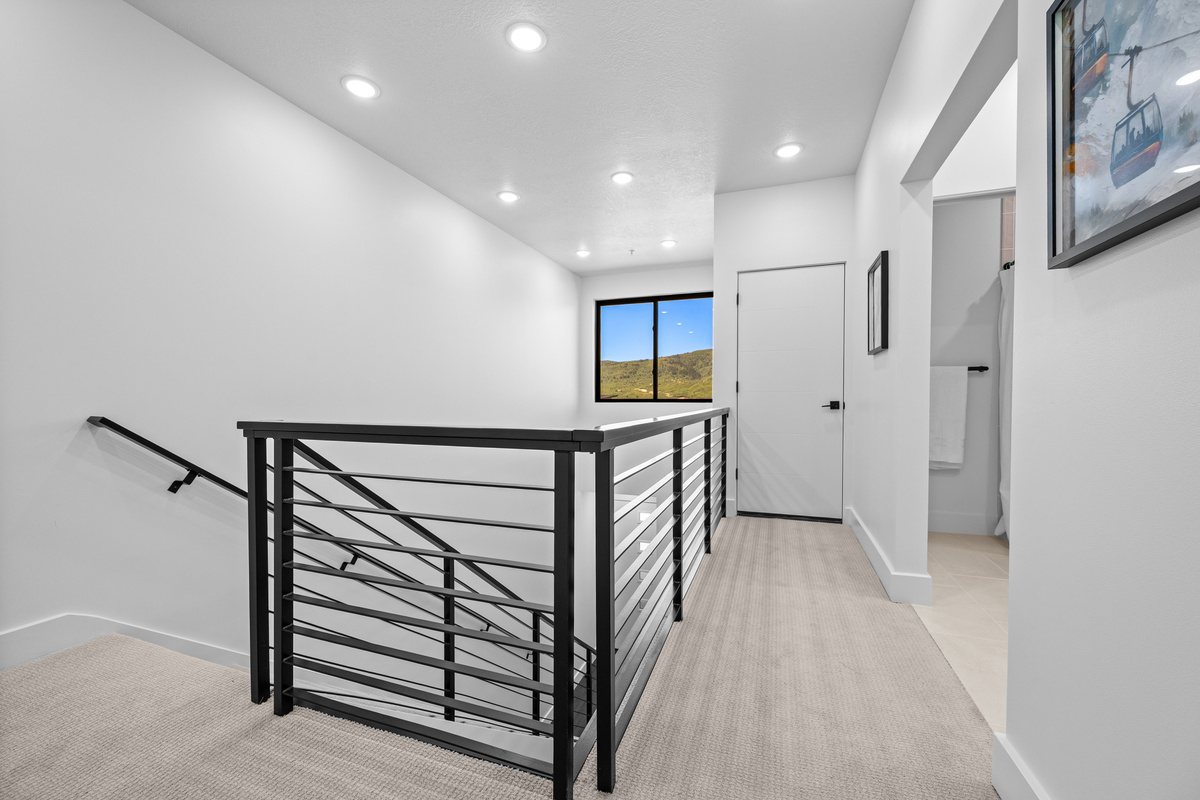 Open upper-level hallway overlooking the main floor below.