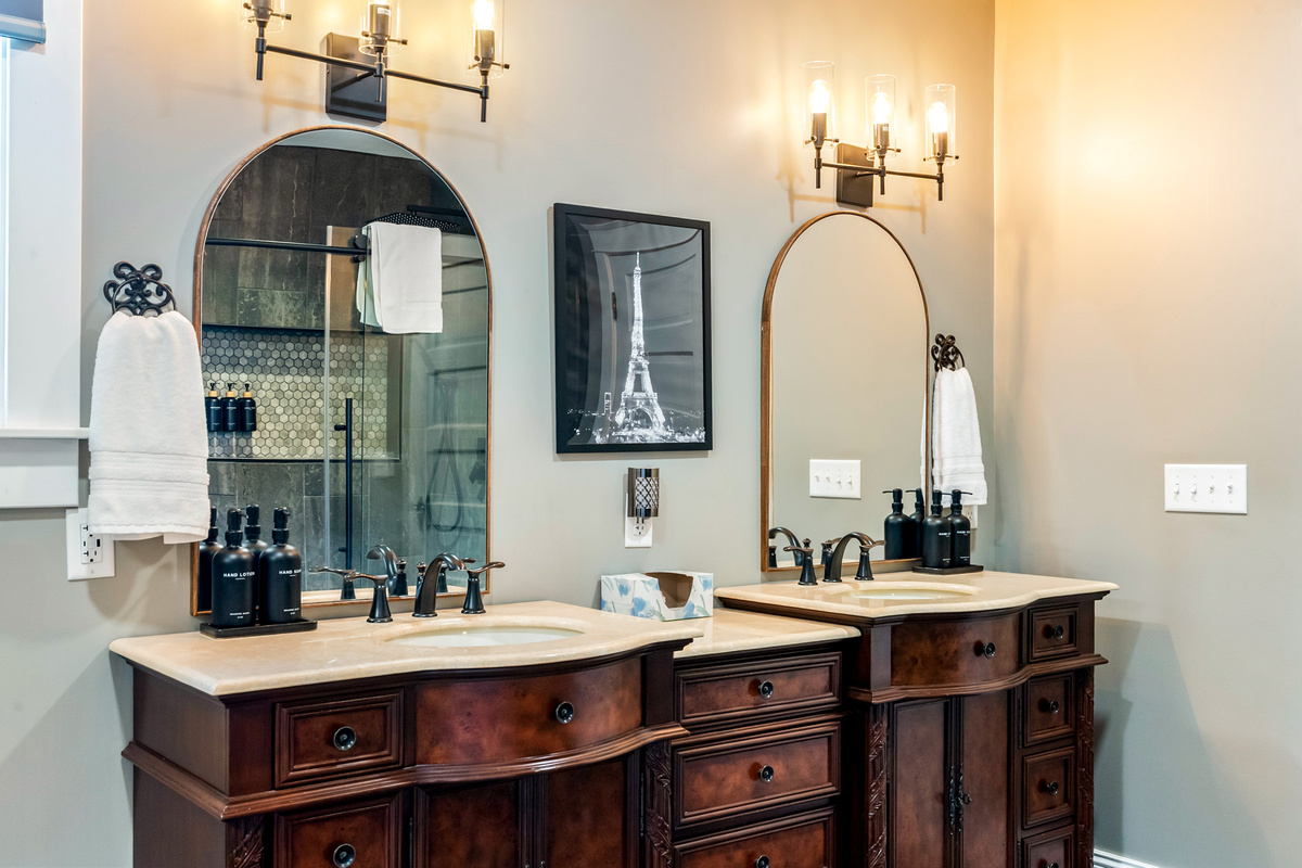 No morning rush here. The primary ensuite bathroom offers plenty of space with an elegant double vanity and beautiful design details.