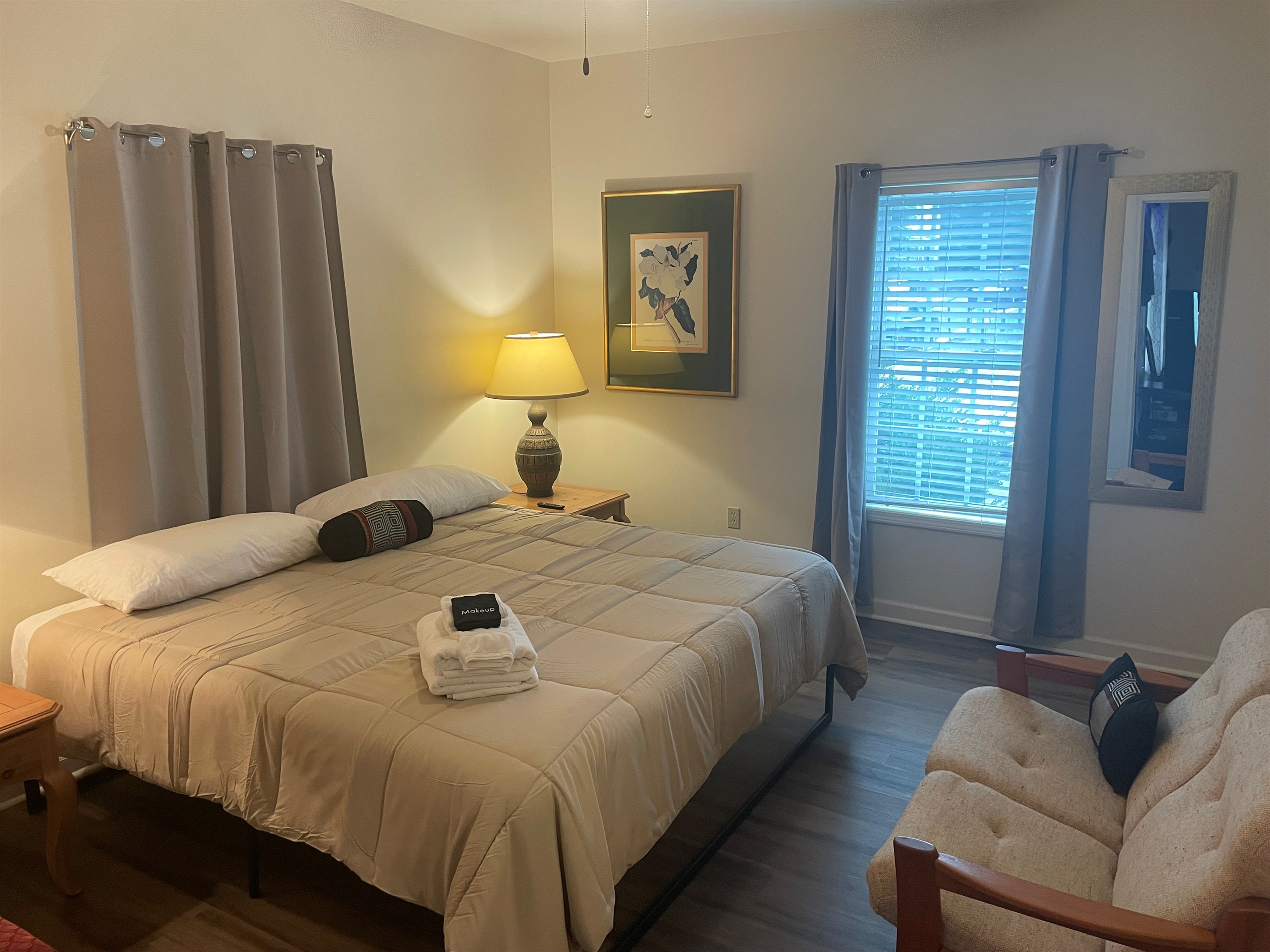 Primary suite on the main level has a large walk in closed, sitting area, and en suite full bath. Welcome home!