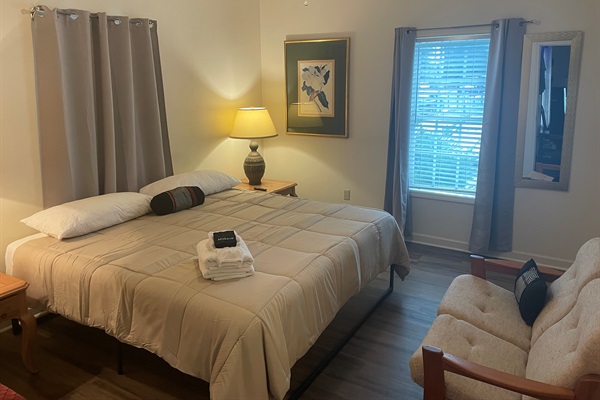 Primary suite on the main level has a large walk in closed, sitting area, and en suite full bath. Welcome home!