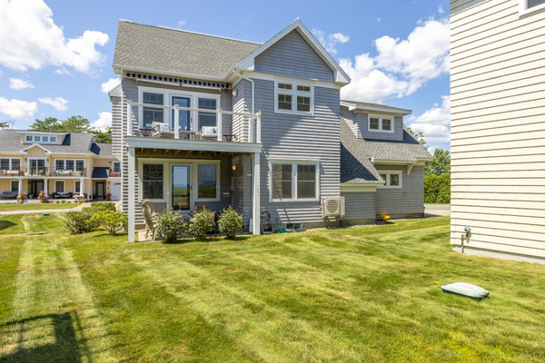 Step outside and enjoy the relaxed coastal setting from the home's backyard and patio area.