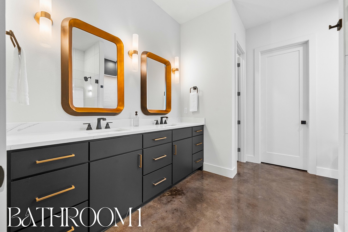 With dual vanities and ample counter space, this bathroom is perfect for easy mornings and adds a touch of luxury to your stay.