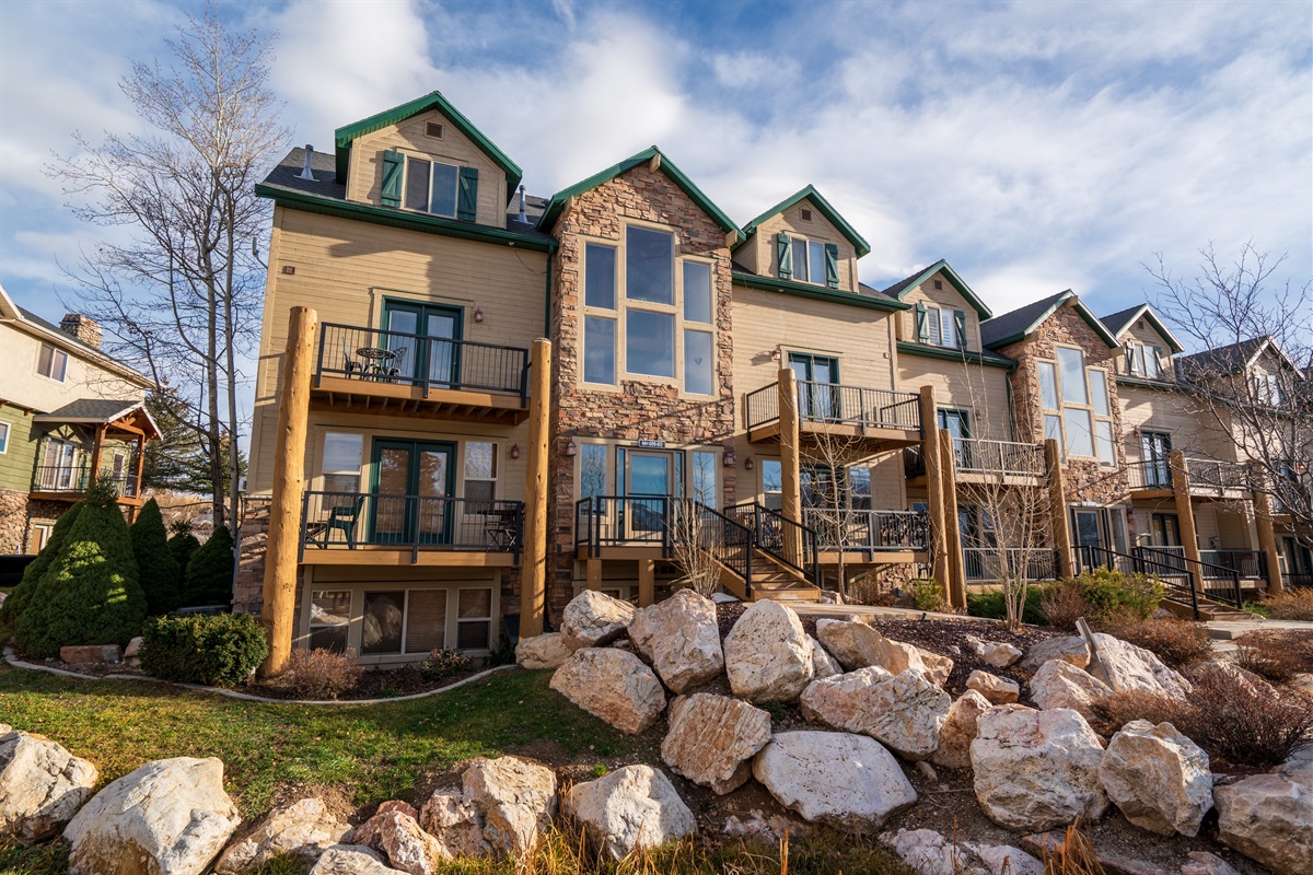 Beautifully landscaped mountain architecture nestled into the heart of Moose Hollow.