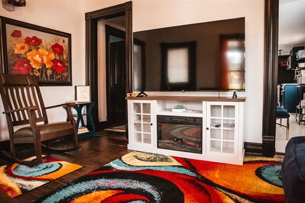 Watch the game on your large 65" Roku tv, fireplace stand, or enjoy a book on the rocker.