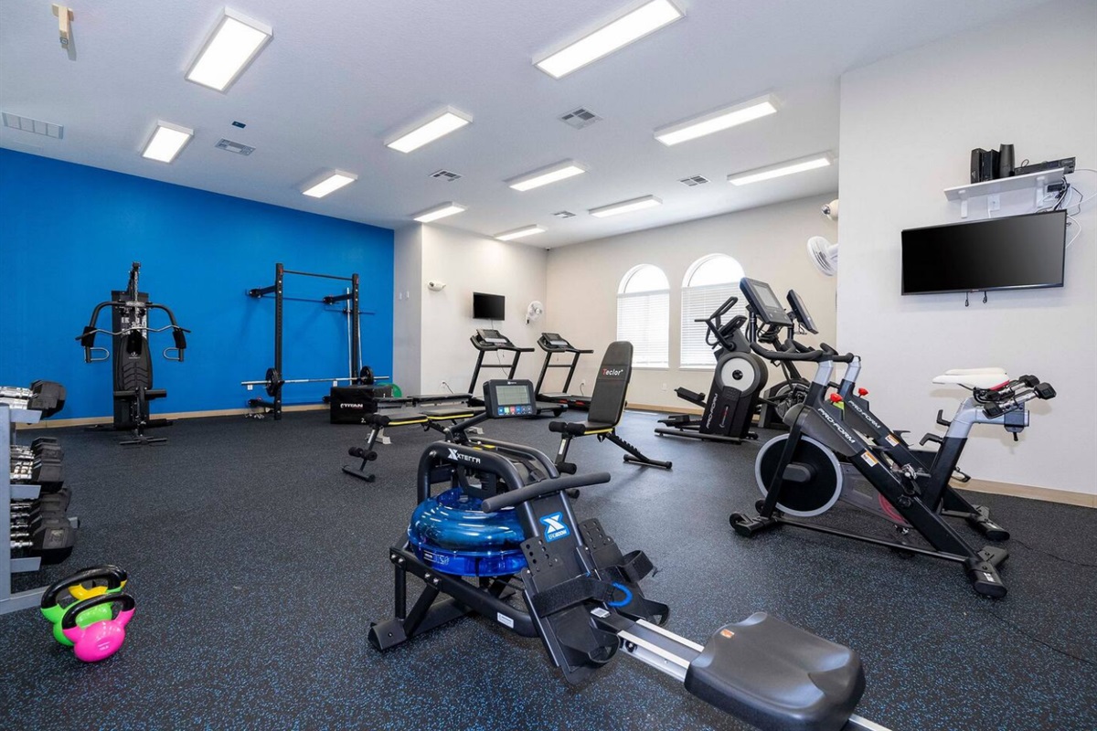 Fitness center with cardio and weight equipment available to guests.