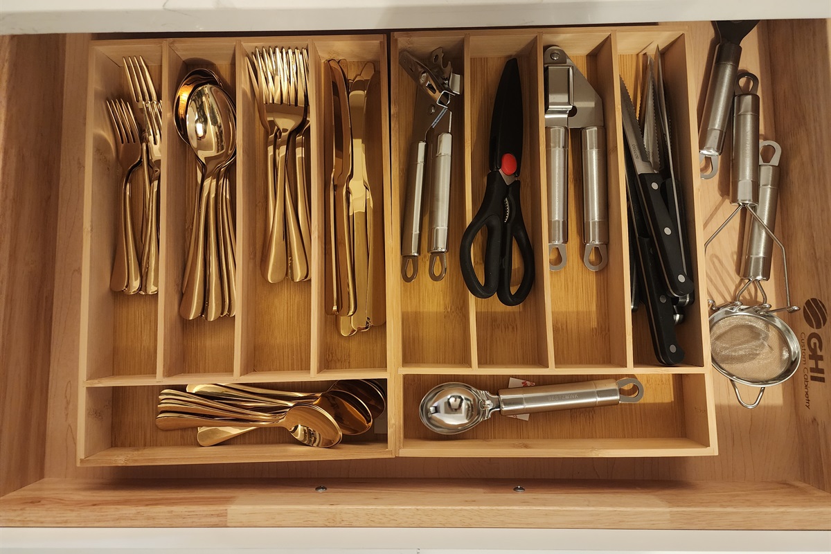 Bright gold silverware, and plenty of utensils