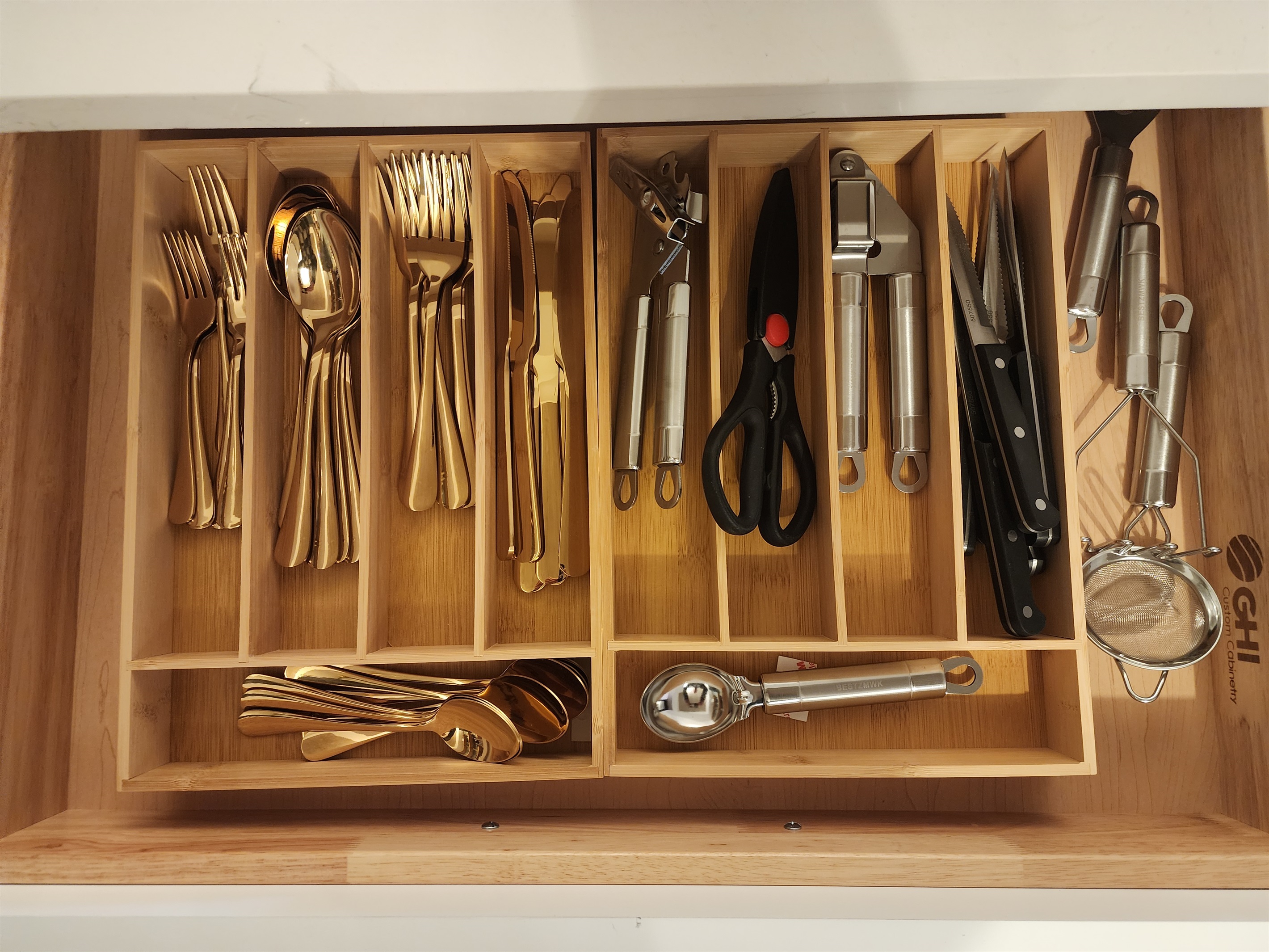 Bright gold silverware, and plenty of utensils