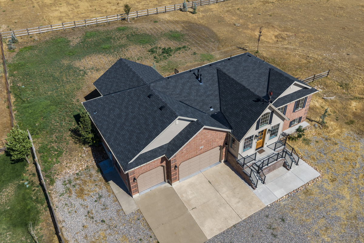This overhead perspective showcases the home’s spacious layout, surrounding acreage, and peaceful atmosphere.