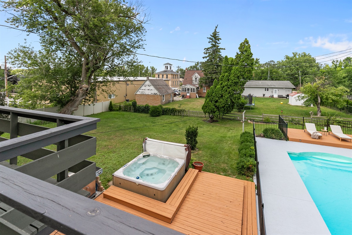 The backyard features a private hot tub, offering the perfect place to unwind and soak while surrounded by fresh air and peaceful views.