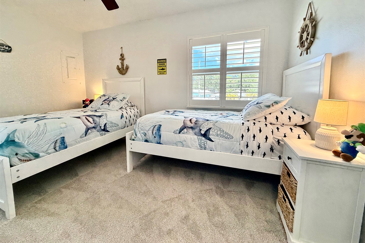 Two comfy twin beds create the ideal space for a cozy night’s sleep.