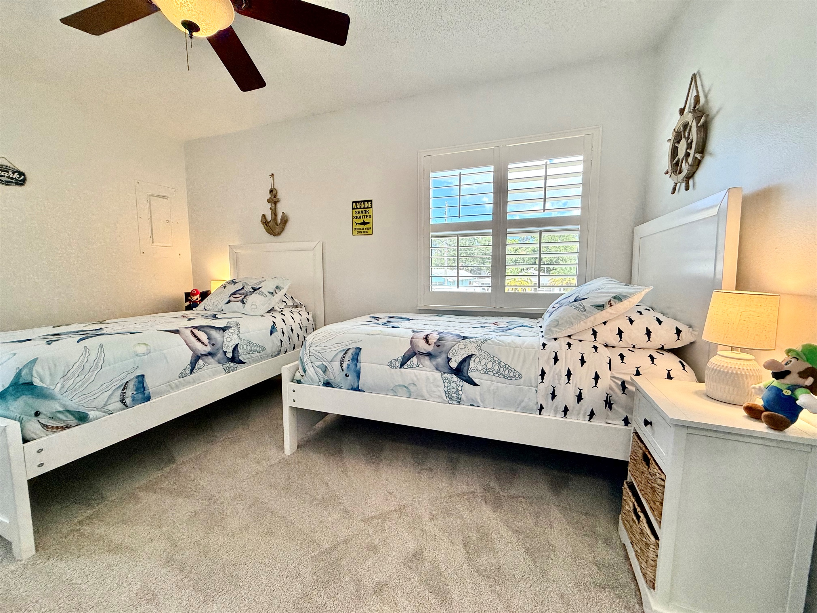 Two comfy twin beds create the ideal space for a cozy night’s sleep.