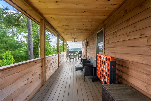 The deck features an outdoor dining area — perfect for sunset dinners or morning coffee.