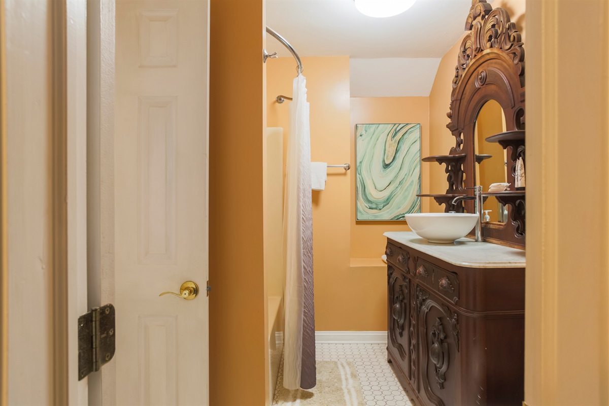 Fresh and functional—the bathroom features a spacious vanity with plenty of room to get ready for the day.