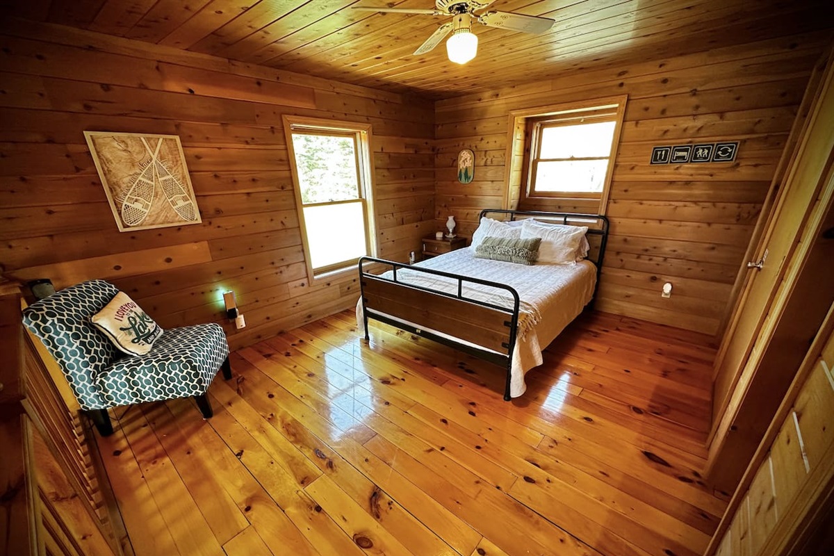 Loft overlooking the living room with a queen bed
