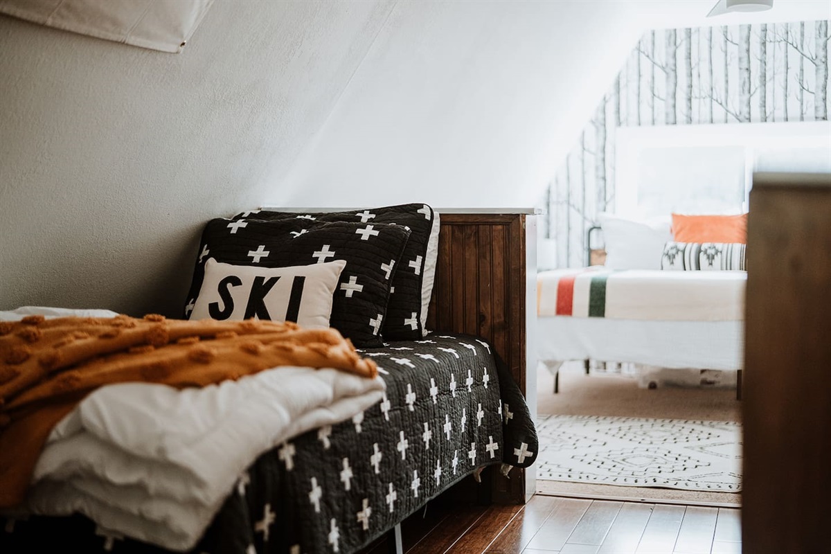 The upstairs has a twin bed as well as a roll away bed if you need it. 