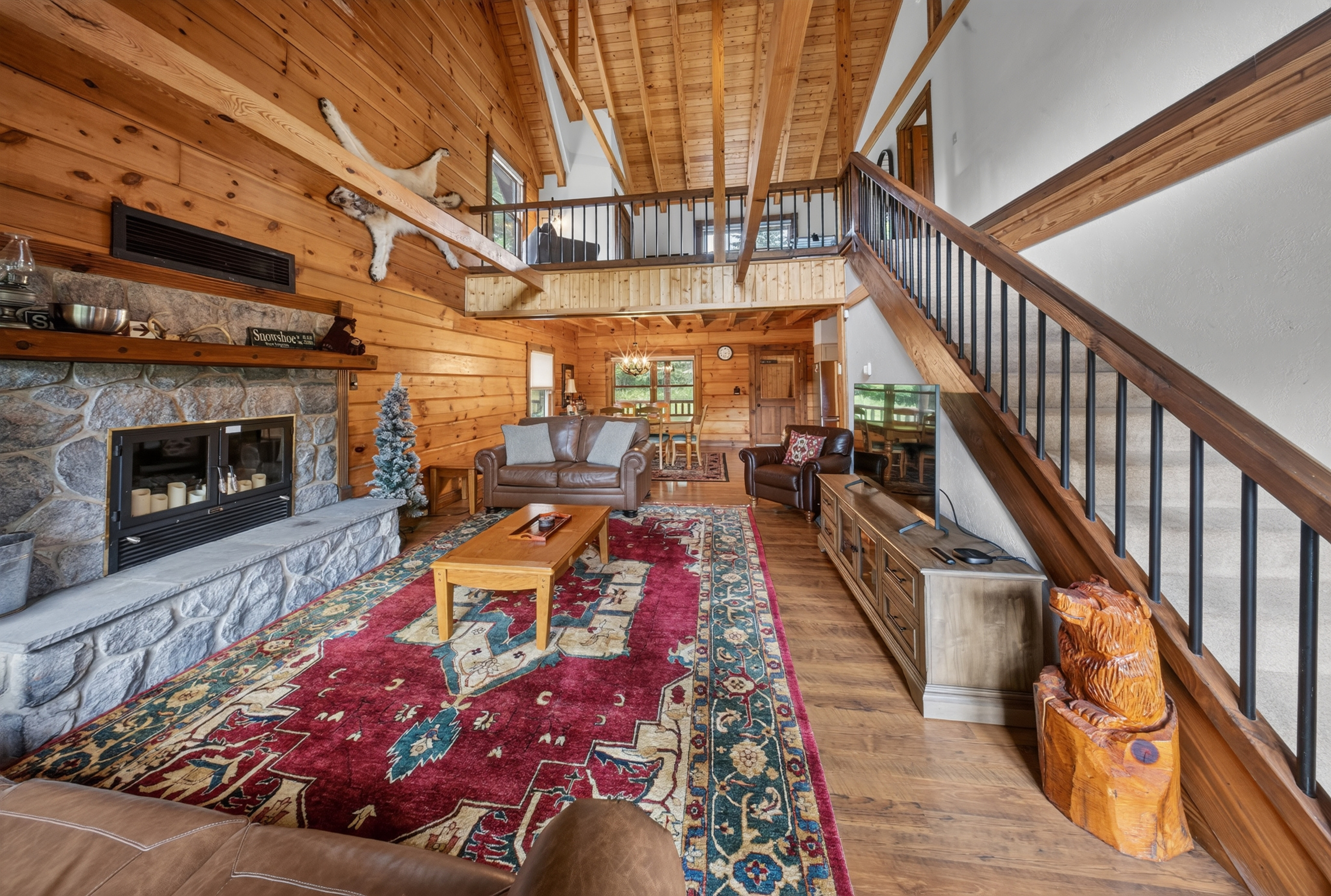 View from the patio doors looking in on the spacious family room with plenty of seating and RokuTV.