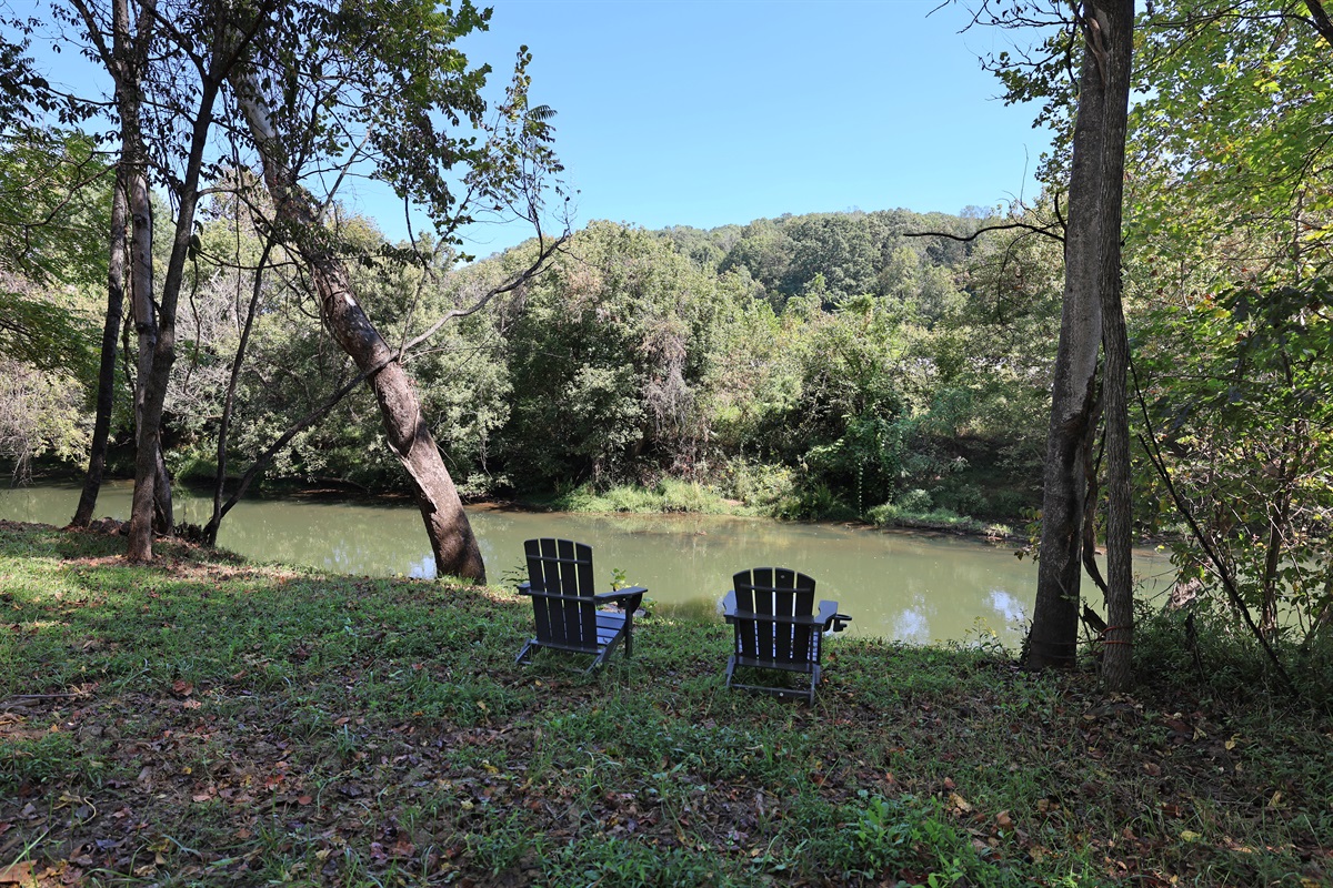 Relax by the river behind the house with your morning coffee
