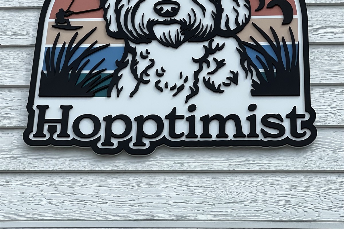 House sign welcoming you to Hopptimist!