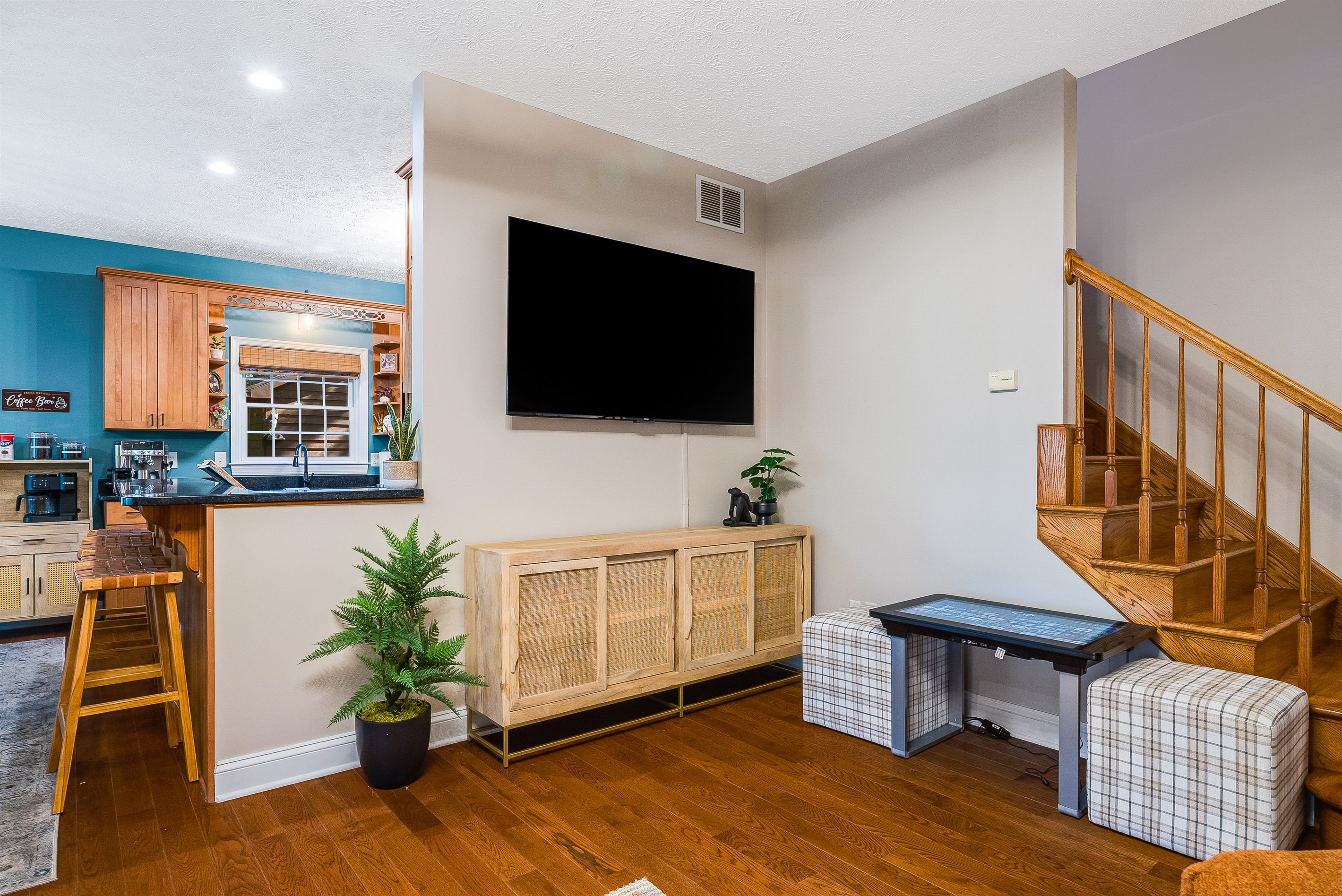 Large smart TV and retro arcade console for family fun