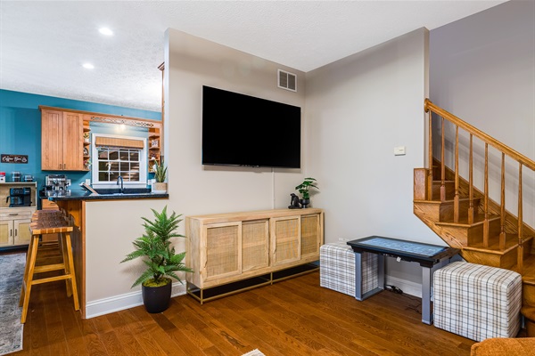 Large smart TV and retro arcade console for family fun