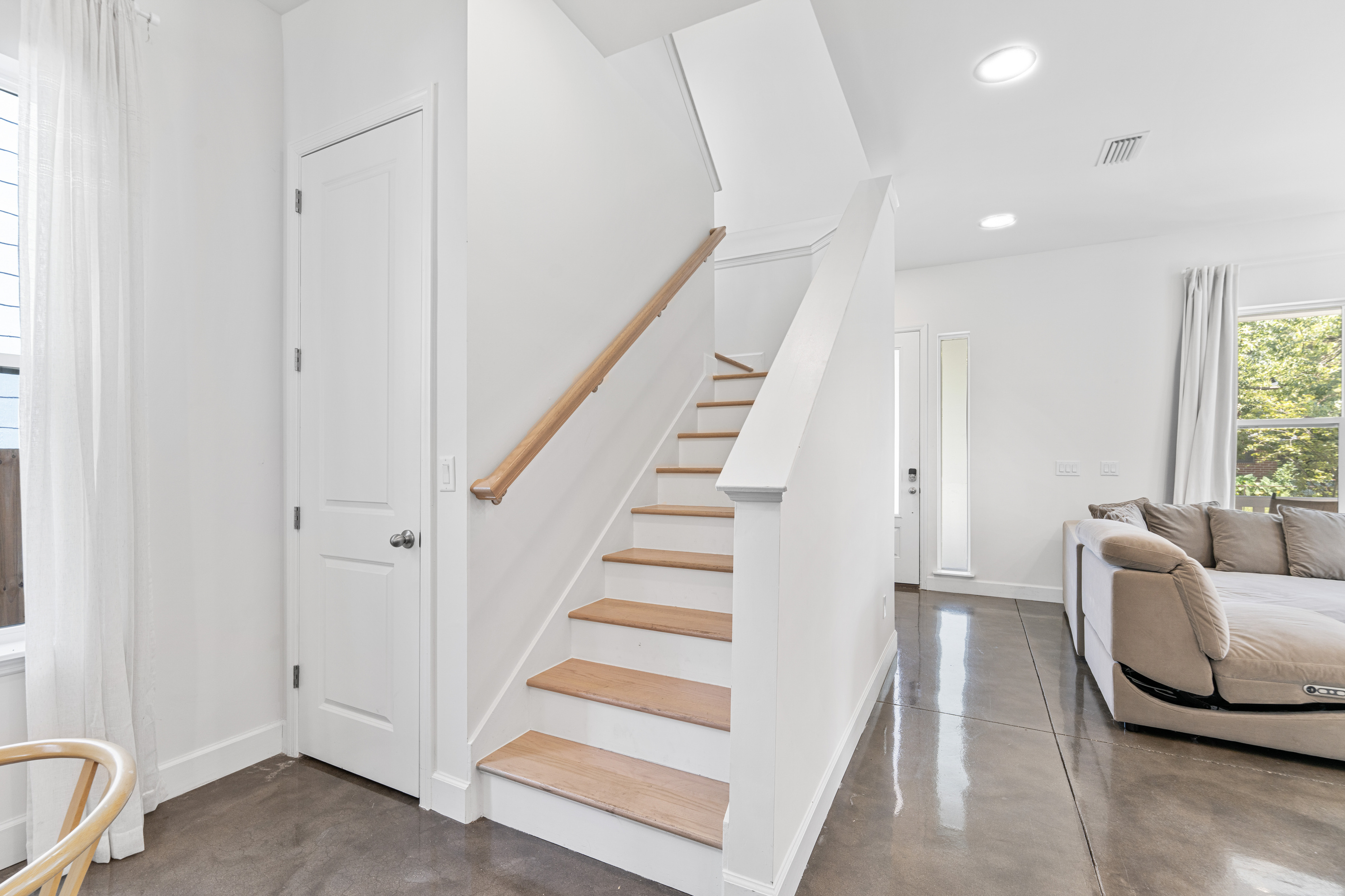 Warm oak treads leading up to where everyone sleeps. You will learn the sound of each footfall by the second night, the pad of small feet coming down for breakfast, the creak of the last one heading up to bed.