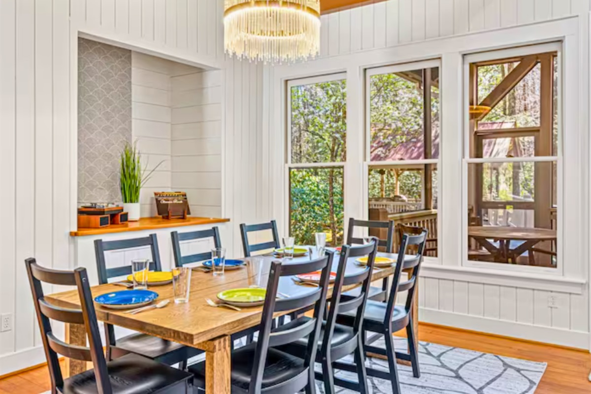 Seating for 8 at the Dining Table in the Dining Room with Large Windows
