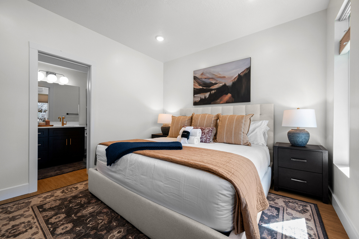 This bright bedroom offers a calm, comfortable space to recharge between mountain adventures.